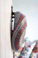 Wool hat hanging on door, detail