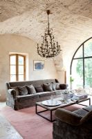 Country living room with vaulted ceiling