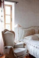 Country bedroom with distressed furniture