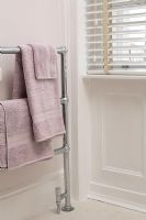 Towel radiator in modern bathroom 