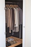 Clothes and shoes in wardrobe, detail