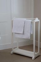Modern towel rail in bathroom 