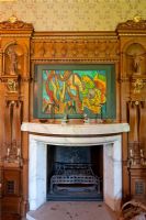Modern painting over classic mantelpiece
