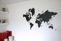 Black map mural on white living room wall