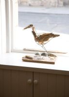 Sea bird sculpture on windowsill 