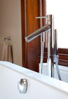 Modern bath with contemporary mixer tap