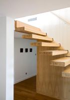 Modern hallway and wooden staircase 