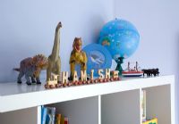 Toys on shelf in childrens room, detail
