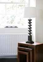 Sculptured lamp on modern nest of tables 