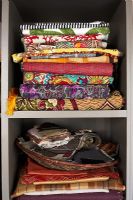 Shelves of colourful fabrics, detail