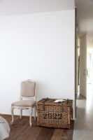 Chair and storage basket in modern bedroom