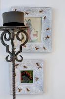 Modern hat stand and paintings, detail