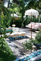 Garden furniture around natural pool