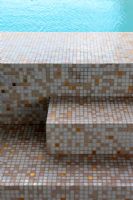 Mosaic tile steps to swimming pool detail