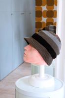 Head sculpture wearing woolen hat