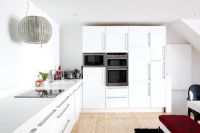Kitchen diner with decorative extractor hood over hob