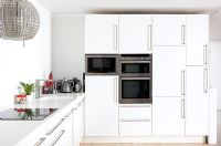 Kitchen diner with decorative extractor hood over hob