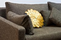 Detail of grey sofa and cushions