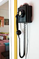 Black wall mounted vintage telephone