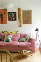 Pink sofa and colourful artwork