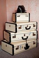 Vintage chests used as bedroom storage