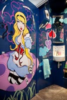 Alice in wonderland mural in childrens bathroom