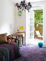 Childrens room with purple rug