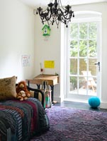 Childrens room with purple rug