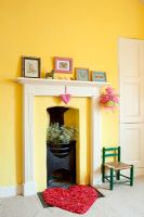 Small cast iron fireplace in childs room