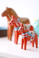 Collection of colourful carved horses, detail