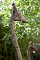 Carved wooden giraffe in garden, detail