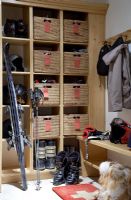 Ski equipment in modern cloakroom 