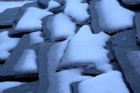 Detail of slate roof tiles covered with snow
