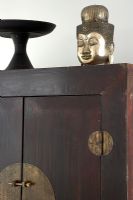 Large wooden oriental cupboard and sculpture
