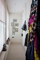 Modern hallway with colourful coats and scarves