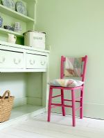 Green dresser and pink chair