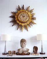 Ornate clock over mantelpiece