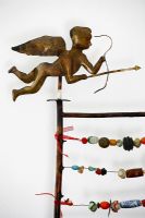Cupid statue and bead abacus sculpture