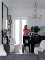 Woman arranging flowers in contemporary living room