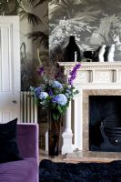 Flowers by fireplace