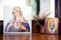 Religious picture and candle on dressing table