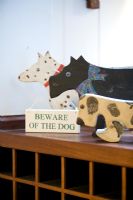 Wooden dog toys and 'Beware of the Dog' sign