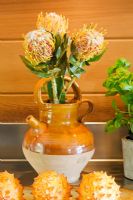 Flower arrangement in earthenware jug