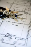 Close up of keys on architectural drawings 