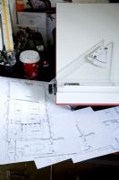 Close up of architectural drawings on desk