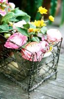 Vintage roses in ornate metal planter