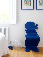 Blue novelty chair in bedroom