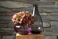 Hydrangea in grey glass vase