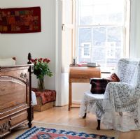 Armchair and bureau in classic bedroom 