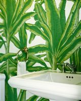 Green wallpaper and sink